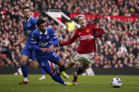 Manchester United's Alejandro Garnacho, right is fouled by Everton's Ben Godfrey who gave a way a penalty to Manchester United during an English Premier League soccer match between Manchester United and Everton at the Old Trafford stadium in Manchester, England, Saturday, March 9, 2024. (AP Photo/Dave Thompson)