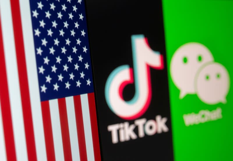 U.S. flag is seen on a smartphone in front of displayed Tik Tok and WeChat logos in this illustration