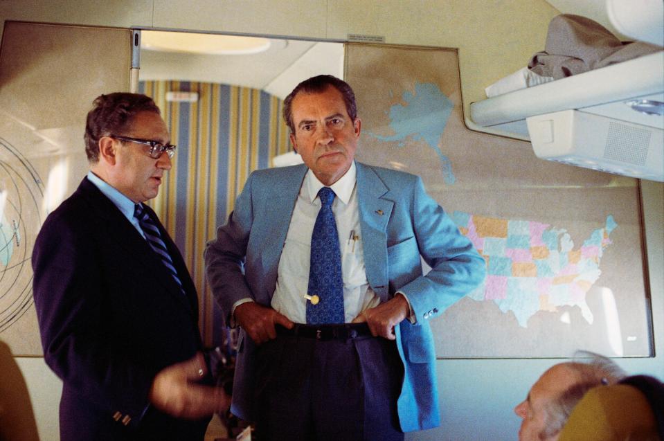 U.S. President Richard Nixon and National Security Adviser Henry Kissinger stand on Air Force One (via REUTERS)