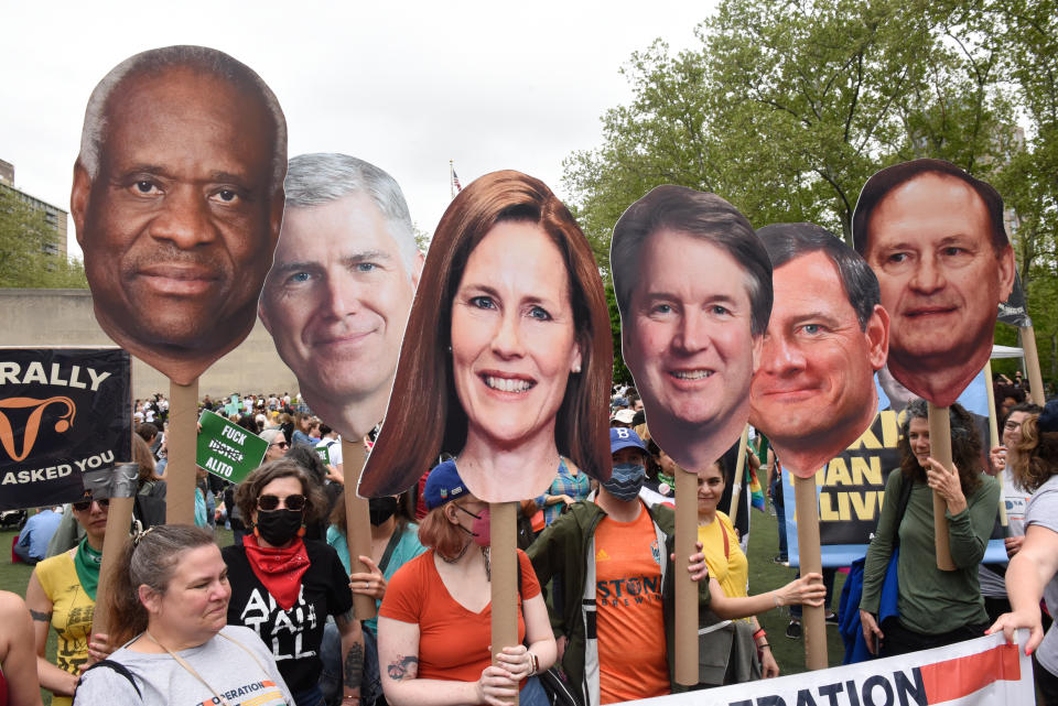 Abortion rights supporters hold signs of U.S. Supreme Court Justices as they participate in a rally and march on May 14, 2022 in New York City. (Stephanie Keith/Getty Images)