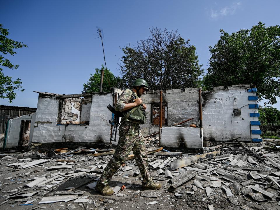 A soldier of AFU is seen in Zelene Pole village destroyed by the Russian shelling, Donetsk Region, eastern Ukraine