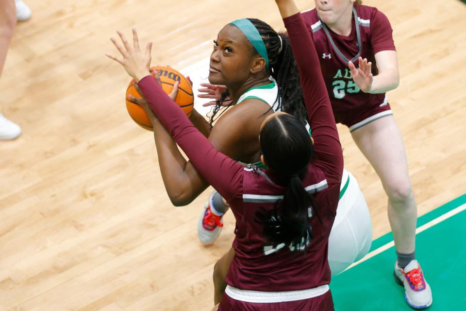 Sofi Woodson of Jones tries to get past Ada's Jamieson Emarthle during the Jones Kiwanis Invitational high school basketball tournament between Ada and Jones in Jones, Okla, on Friday, Jan. 19, 2024.