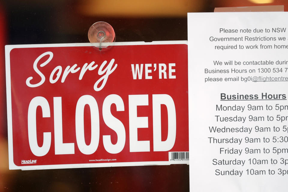 A commercial business is closed in Sydney on Aug. 13, 2021, as greater Sydney continues a weeks-long COVID-19 lockdown. Japan, Australia and New Zealand all got through the first year of the coronavirus pandemic in relatively good shape, but now are taking very divergent paths in dealing with new outbreaks of the fast-spreading delta variant. (AP Photo/Rick Rycroft)