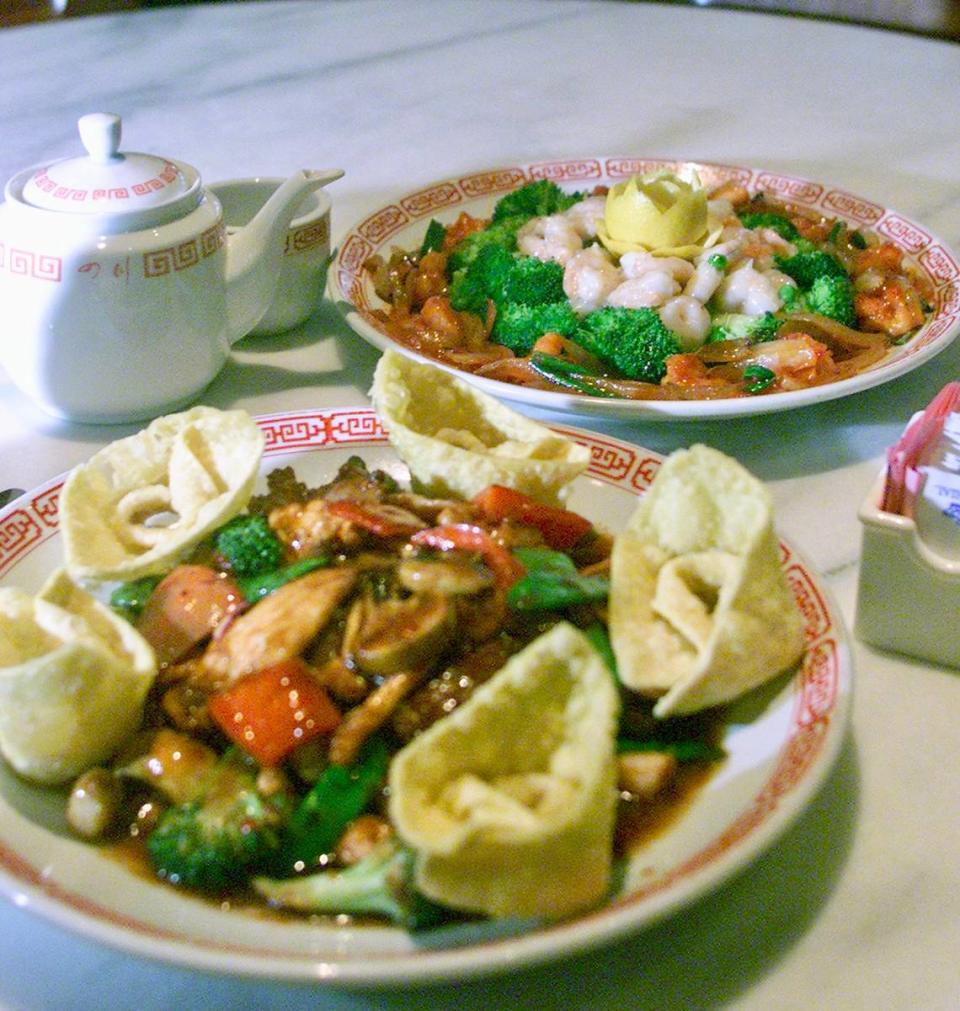 The “Happy Family” combination dinner with shrimp, scallops, beef, chicken, pork, broccoli, snow peas, red bell peppers and mushrooms at Szechuan Restaurant, along with a shrimp plate, seen Feb. 27, 2001.