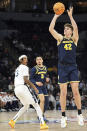 Michigan forward Will Tschetter (42) shoots against Penn State during the first half of an NCAA college basketball game in the first round of the Big Ten Conference men's tournament Wednesday, March 13, 2024, in Minneapolis. (AP Photo/Abbie Parr)