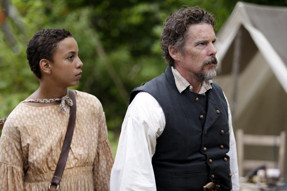 Joshua Caleb Johnson as Henry and Ethan Hawke as abolitionist John Brown in Showtime miniseries "The Good Lord Bird."