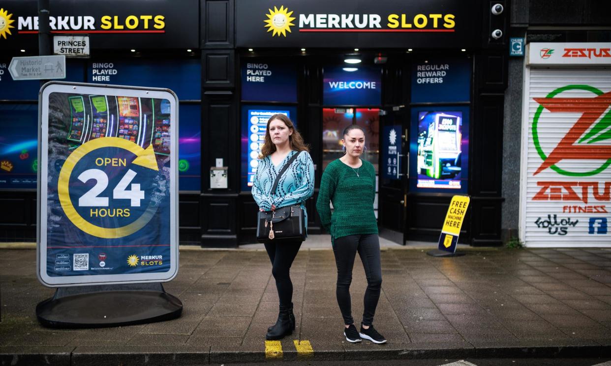 <span>Wendy Hughes’s daughters, Maria and Jackie Olden, outside the Merkur branch in Stockport. Jackie says gambling would once never have entered her mother’s head.</span><span>Photograph: Joel Goodman/The Guardian</span>