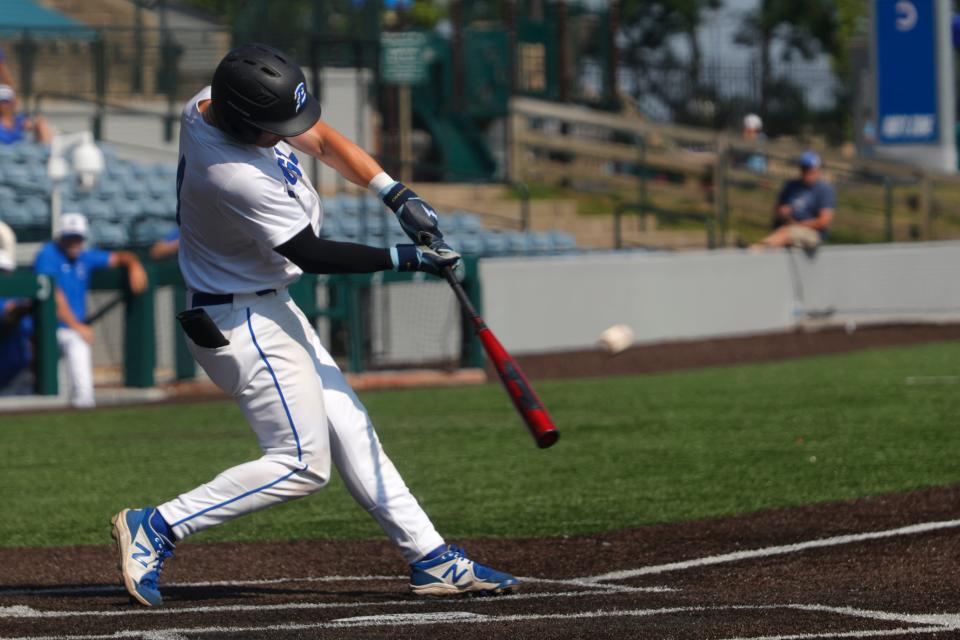 Eastern’s Carson Shee hits a run against Shelby County in the Clark's Pump-N-Shop Baseball State Tournament on June 3, 2023.