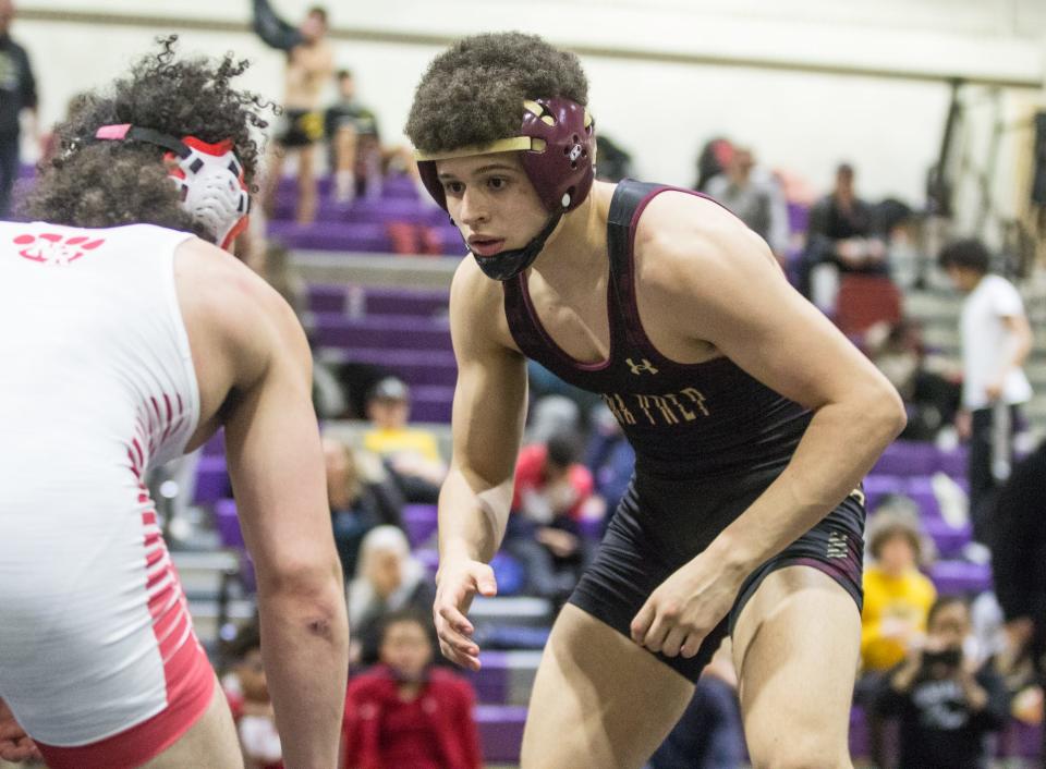 Iona Prep's Kosta Koufalis (black) defeated North Rockland's Tyce Vandergoot (white) in the 145-pound finals of the Murphy-Guccione Shoreline Classic at New Rochelle High School on Saturday, Jan. 7, 2023.