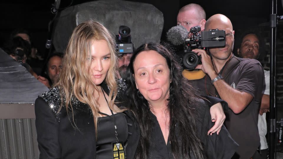 Delvey (left), wearing a bedazzled suit jacket designed by Shao Yang, poses with publicist Kelly Cutrone (right) after the show. - Courtesy Shao