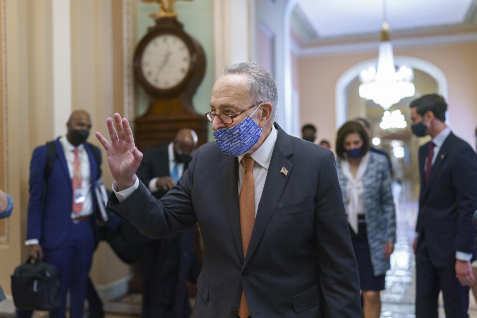 On the first full day of Democratic control, Senate Majority Leader Chuck Schumer, D-N.Y., walks to the chamber after meeting with new senators from his caucus, at the Capitol in Washington, Thursday, Jan. 21, 2021. (AP Photo/J. Scott Applewhite)