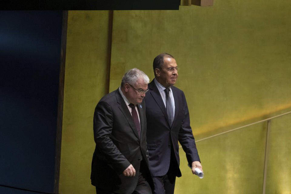 Russia's Foreign Minister Sergey Lavrov, right, walks onto the stage to address the 74th session of the United Nations General Assembly at United Nations headquarters Friday, Sept. 27, 2019. (AP Photo/Kevin Hagen).