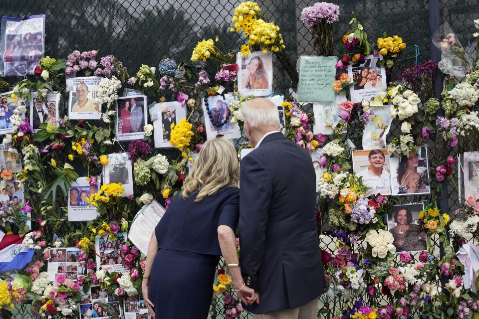 FILE - In this July 1, 2021, file photo President Joe Biden and first lady Jill Biden visit the Surfside Wall of Hope & Memorial in Surfside, Fla., for the people missing after the condo tower that collapsed earlier in the week. The Bidens spent the day meeting with first responders, local and government officials and visiting with families who have been impacted by the collapse. (AP Photo/Susan Walsh, File)