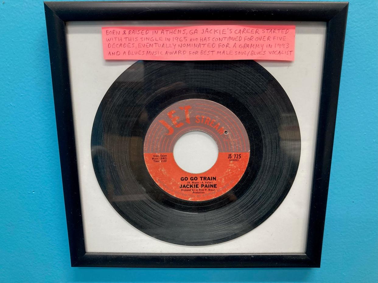 A copy of R&B artist Jackie Payne's 1965 debut single "Go Go Train" is on the wall at Wuxttry Records in Athens, Ga. on Oct. 13, 2023. The spelling of Payne's last name was changed after his early 45 single releases.