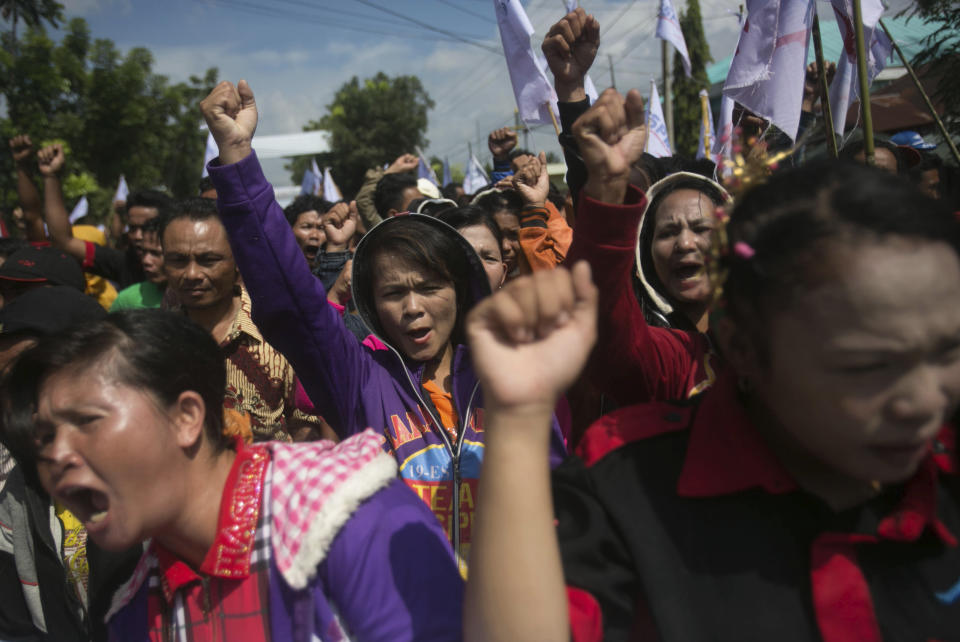 Palm oil workers hold a rally demanding to be treated fairly in Rantau Prapat, North Sumatra, Indonesia, on Nov. 15, 2017. The Associated Press has found systematic labor abuses on plantations big and small, including some that meet certification standards set by the global Roundtable on Sustainable Palm Oil, an association whose members include palm oil producers, buyers, traders and environmental watchdogs. (AP Photo/Binsar Bakkara)