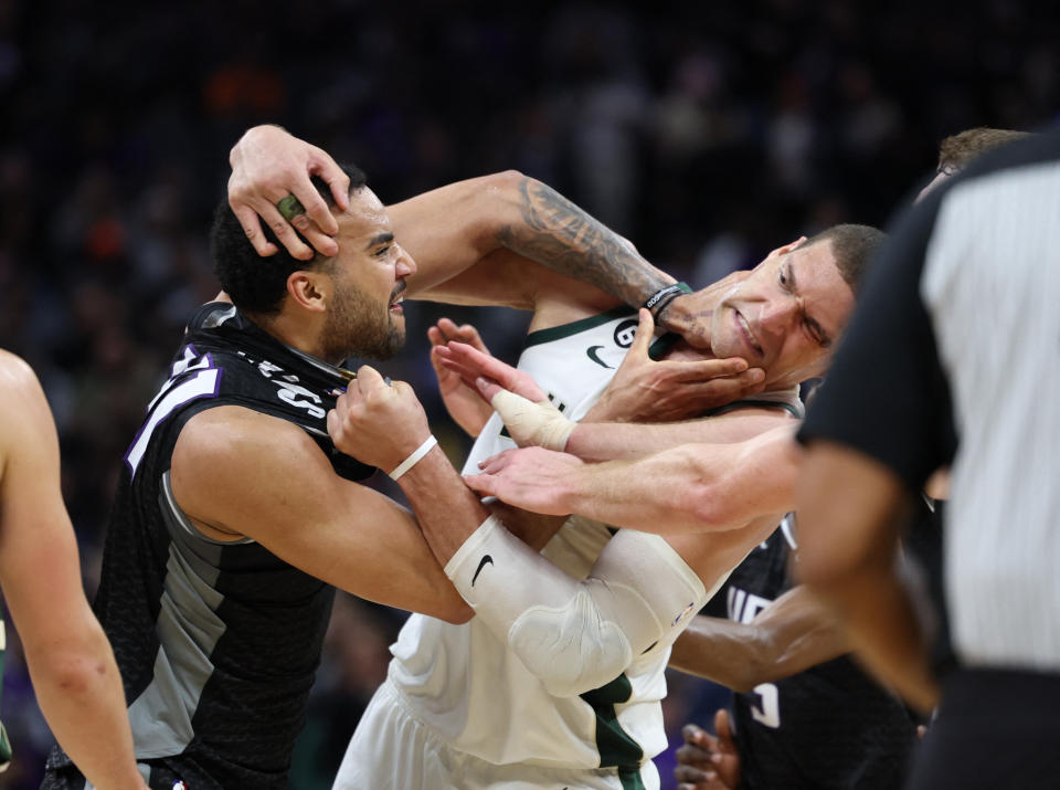 Mar 13, 2023;  Sacramento, California, USA;  Sacramento Kings center Trey Lyles (41) confronts Milwaukee Bucks center Brook Lopez (11) during the fourth quarter at Golden 1 Center.  Mandatory Credit: Kelley L Cox-USA TODAY Sports