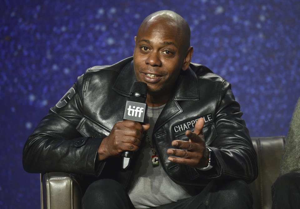 FILE - In this Sept. 8, 2018 file photo, Dave Chappelle speaks at the press conference for "A Star Is Born" on day 4 of the Toronto International Film Festival at the TIFF Bell Lightbox in Toronto. Chappelle is the latest recipient of the Mark Twain prize for lifetime achievement in comedy, an honor being bestowed Sunday, Oct. 27, 2019 at the Kennedy Center for the Performing Arts. (Photo by Evan Agostini/Invision/AP, File)