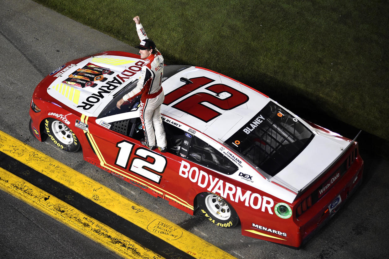 DAYTONA BEACH, FLORIDA - AUGUST 28: Ryan Blaney, driver of the #12 BodyArmor Ford, celebrates after winning the NASCAR Cup Series Coke Zero Sugar 400 at Daytona International Speedway on August 28, 2021 in Daytona Beach, Florida. (Photo by Logan Riely/Getty Images)