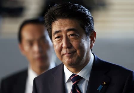 Japan's Prime Minister Shinzo Abe walks into the Prime Minister's official residence in Tokyo September 3, 2014. REUTERS/Yuya Shino