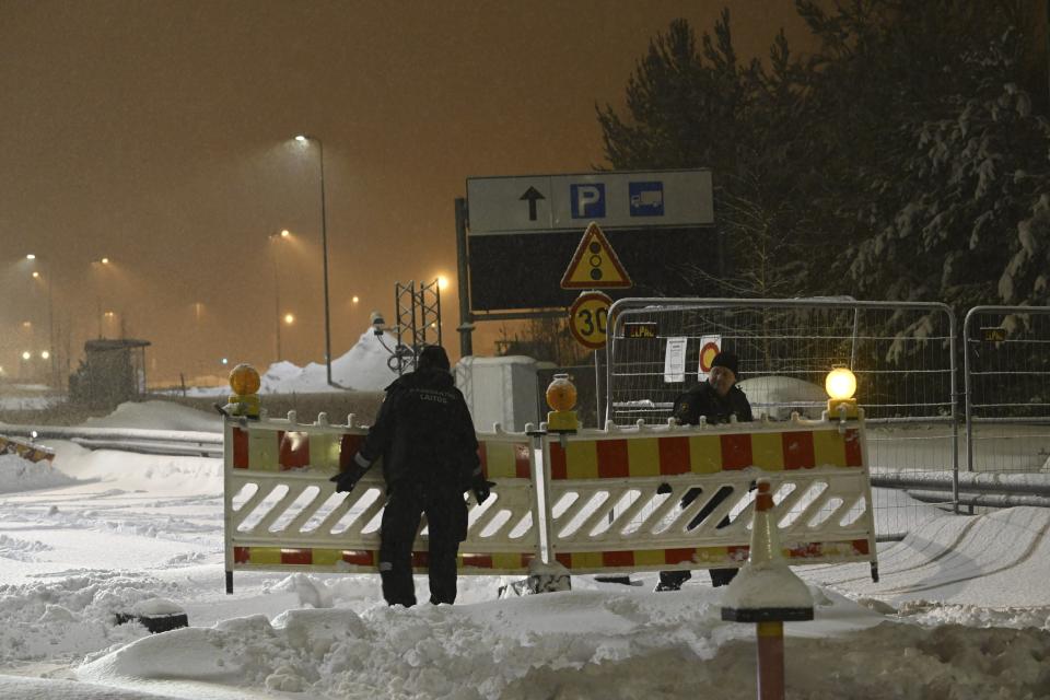 FILE - Finnish Border Guard remove fences at the closed Vaalimaa border check point between Finland and Russia in Virolahti, Finland, on Dec. 13, 2023. Finland will extend the closure of its border crossing points with Russia beyond the current April 14 deadline “until further notice” due to a high risk of organized migration orchestrated by Moscow, the Finnish government said on Thursday, April 4, 2024. (Heikki Saukkomaa/Lehtikuva via AP)