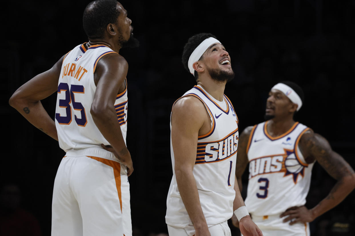 Los Angeles, CA, Thursday, January 11, 2024 - Phoenix Suns forward Kevin Durant (35), guard Devin Booker (1) and guard Bradley Beal (3) lead the Suns to a 127-109 win over the Lakers at Crypto.Com Arena. (Robert Gauthier/Los Angeles Times via Getty Images)