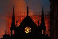 As night fell, groups of <a rel="nofollow noopener" href="https://people.com/travel/notre-dame-cathedral-fire-onlookers-singing-ave-maria/" target="_blank" data-ylk="slk:onlookers began singing "Ave Maria";elm:context_link;itc:0;sec:content-canvas" class="link ">onlookers began singing "Ave Maria"</a> while watching the cathedral go up in flames. Although officials had previously thought the structure would be unsalvageable after the blaze, a fire official <a rel="nofollow noopener" href="https://www.cnbc.com/2019/04/15/paris-notre-dame-cathedral-on-fire-reuters.html" target="_blank" data-ylk="slk:told CNBC;elm:context_link;itc:0;sec:content-canvas" class="link ">told CNBC</a> that as of 11:20 p.m. local time, the main building's integrity had been saved and the fire had been contained.