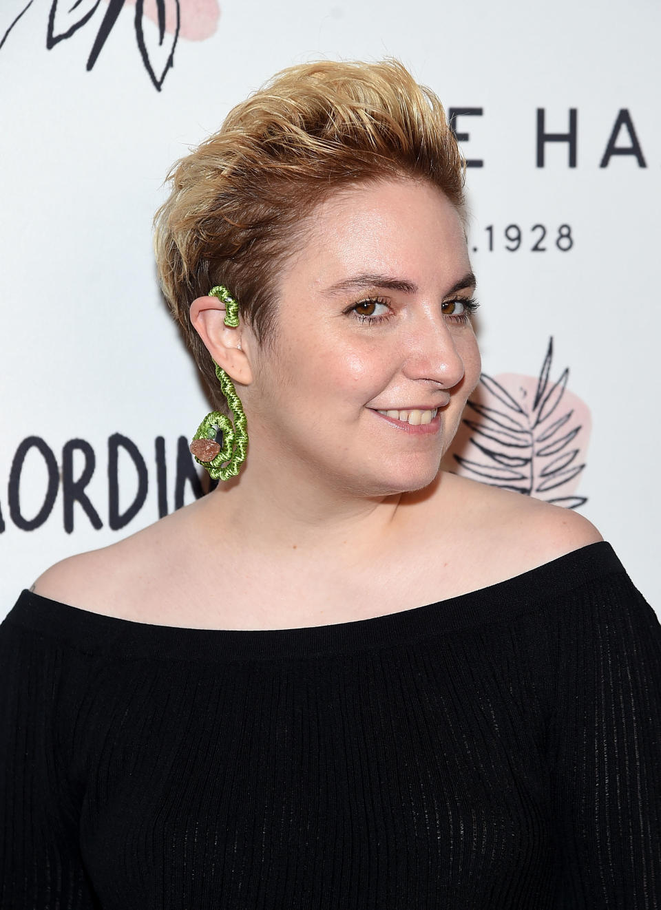 Lena Dunham disrobes for a photo shoot — by her photographer mom — wearing only body paint. (Photo: Getty Images)