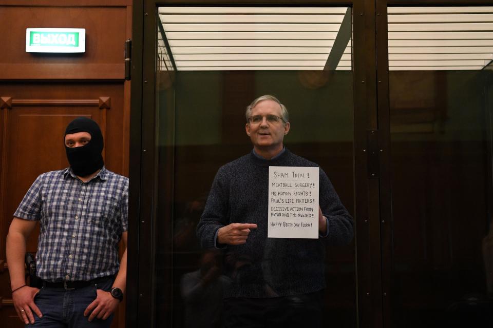 Paul Whelan, accused of espionage and arrested in Russia in December 2018, stands inside a cage in court as he waits to hear his verdict in Moscow, June 15, 2020.