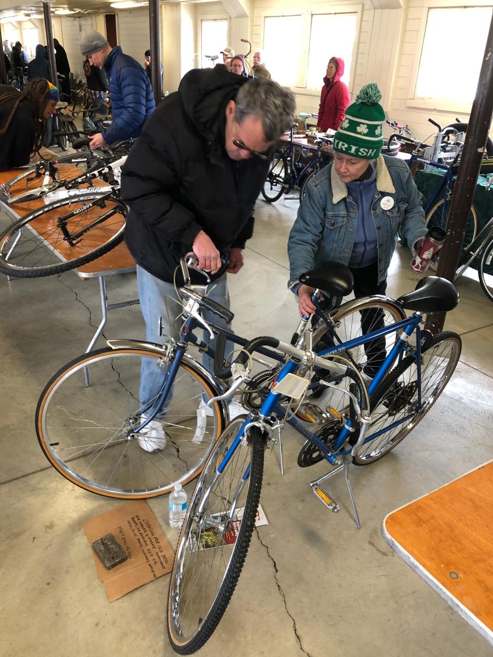 Buyers and sellers examine used bikes at 2022's bike swap meet at St. Patrick's County Park in South Bend.