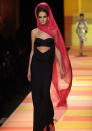 <b>Jean Paul Gaultier SS13 </b><br><br>Coloured headscarves added a pop of colour to all black outfits.<br><br>© Rex