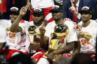 OAKLAND, CALIFORNIA - JUNE 13: The Toronto Raptors celebrate with the Larry O'Brien Championship Trophy after their team defeated the Golden State Warriors to win Game Six of the 2019 NBA Finals at ORACLE Arena on June 13, 2019 in Oakland, California. NOTE TO USER: User expressly acknowledges and agrees that, by downloading and or using this photograph, User is consenting to the terms and conditions of the Getty Images License Agreement. (Photo by Ezra Shaw/Getty Images)