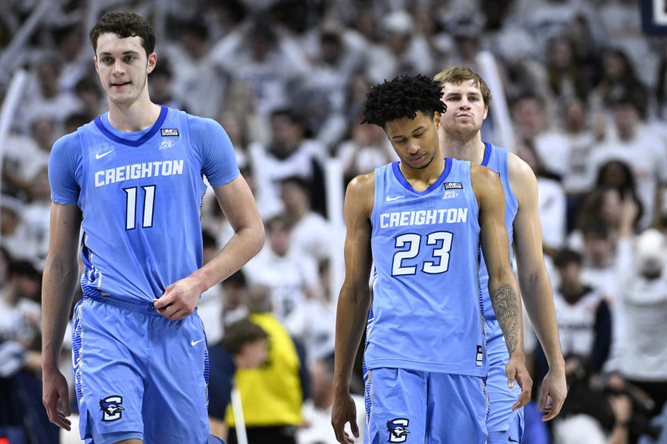 Creighton center Ryan Kalkbrenner, left, Creighton guard Trey Alexander, center, and Creighton forward Isaac Traudt walk together in the second half of an NCAA college basketball game against UConn, Wednesday, Jan. 17, 2024, in Stores, Conn. (AP Photo/Jessica Hill)
