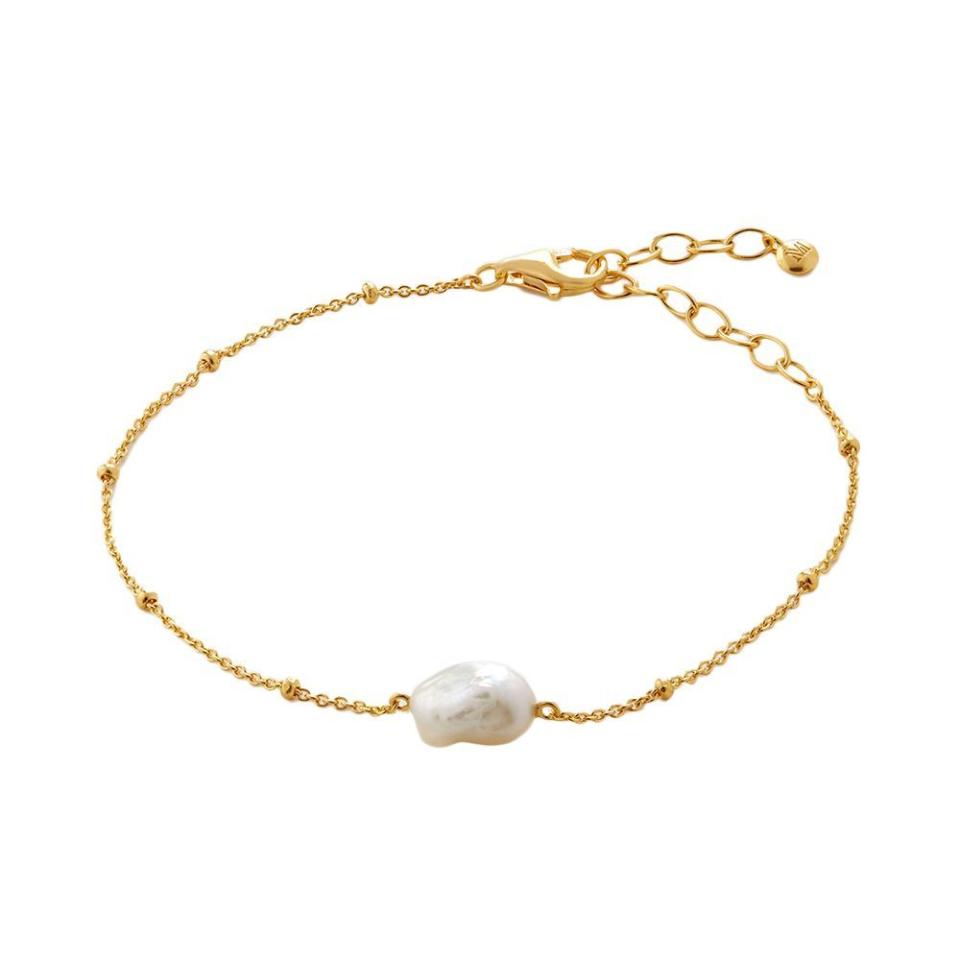 <p><a href="https://go.redirectingat.com?id=74968X1596630&url=https%3A%2F%2Fwww.monicavinader.com%2Fus%2Fnura-tiny-keshi-pearl-bracelet%2Fgold-vermeil-nura-tiny-keshi-pearl-bracelet-pearl&sref=https%3A%2F%2F" rel="nofollow noopener" target="_blank" data-ylk="slk:Shop Now;elm:context_link;itc:0;sec:content-canvas" class="link ">Shop Now</a></p><p>Nura Tiny Keshi Pearl Bracelet</p><p>monicavinader.com</p><p>$135.00</p>