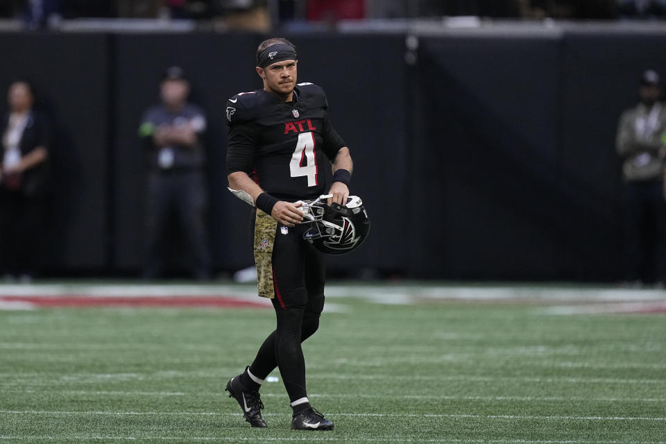 Atlanta Falcons quarterback Taylor Heinicke (4) walks off the field after the team's loss against the Minnesota Vikings after an NFL football game, Sunday, Nov. 5, 2023, in Atlanta. (AP Photo/John Bazemore)