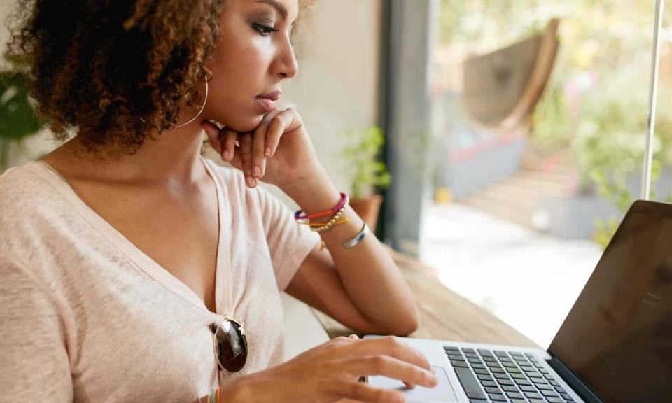 A woman uses a laptop