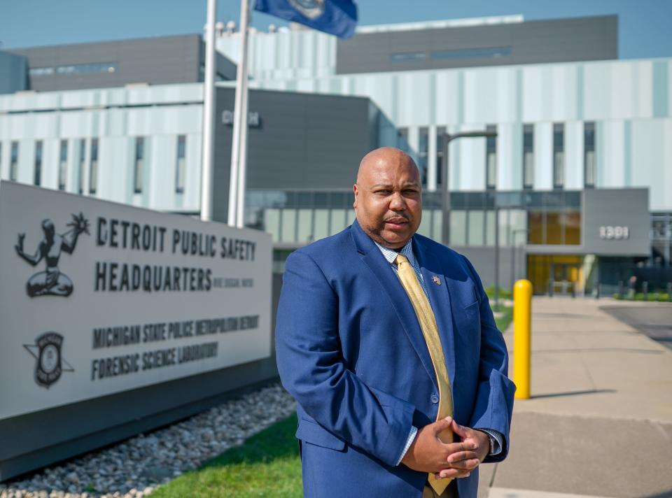 Former Detroit Police Officer Ricardo Moore stands in front of the Detroit Police headquarters in downtown Detroit on Wednesday, July 28, 2021.