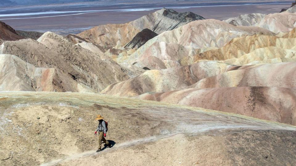 PHOTO: Steve Curry, 71, of Sunland, is walking to Zabriskie Point in Death Valley National Park on July 18, 2023, in Death Valley, Calif. (Francine Orr/Los Angeles Times via Getty Images)