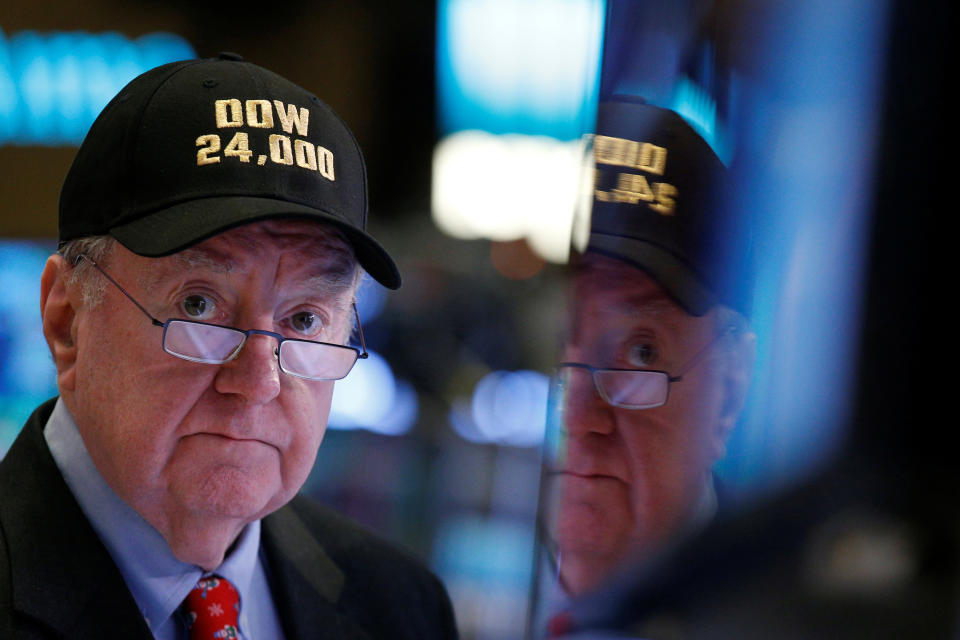 Art Cashin, Director of Floor Operations at UBS, wears a DOW 24,000 hat as he works on the floor of the New York Stock Exchange, (NYSE) as the Dow Jones Industrial Average crosses 24,000, in New York, U.S., November 30, 2017. REUTERS/Brendan McDermid