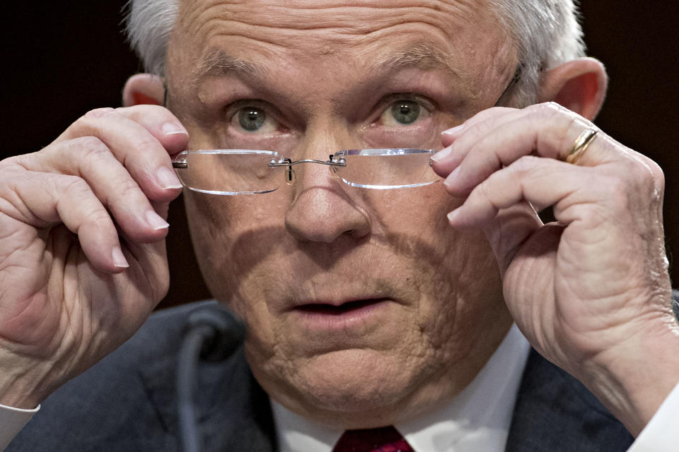 Jeff Sessions, U.S. attorney general, removes his glasses during a Senate Intelligence Committee hearing in Washington, D.C., on June 13, 2017.