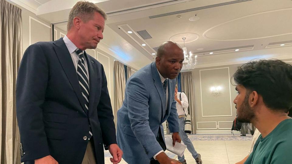 PHOTO: UNC-Chapel Hill Chancellor Kevin Guskiewicz, left, and UNC Chief of Police Brian James console students who had spent hours on lockdown during an active shooter situation on campus, Aug. 28, 2023, in Chapel Hill, N.C. (Hannah Schoenbaum/AP)