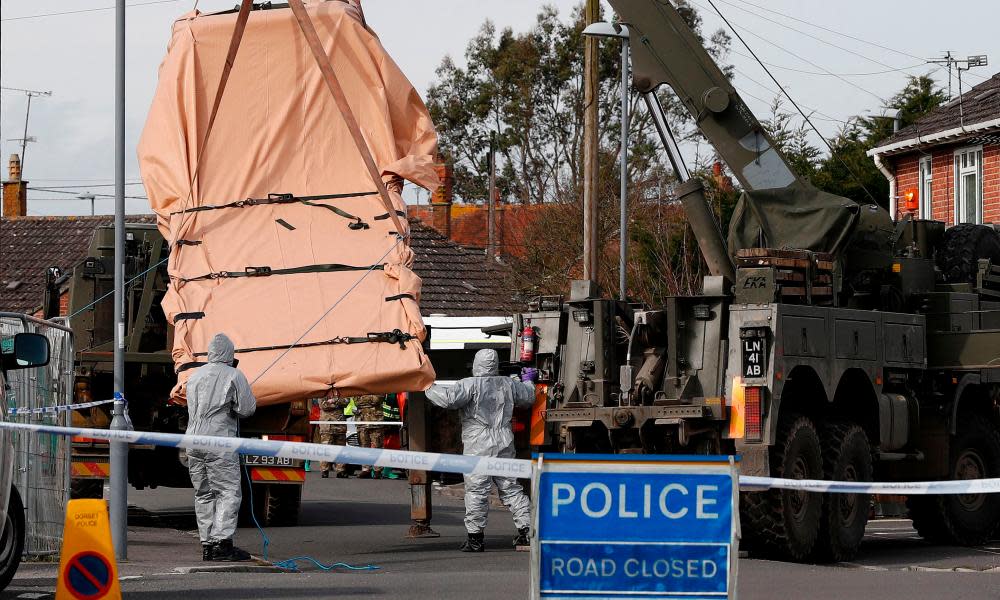 Military personnel remove a vehicle connected to the poisoning of Sergei Skripal from a residential street in Gillingham, Dorset. 