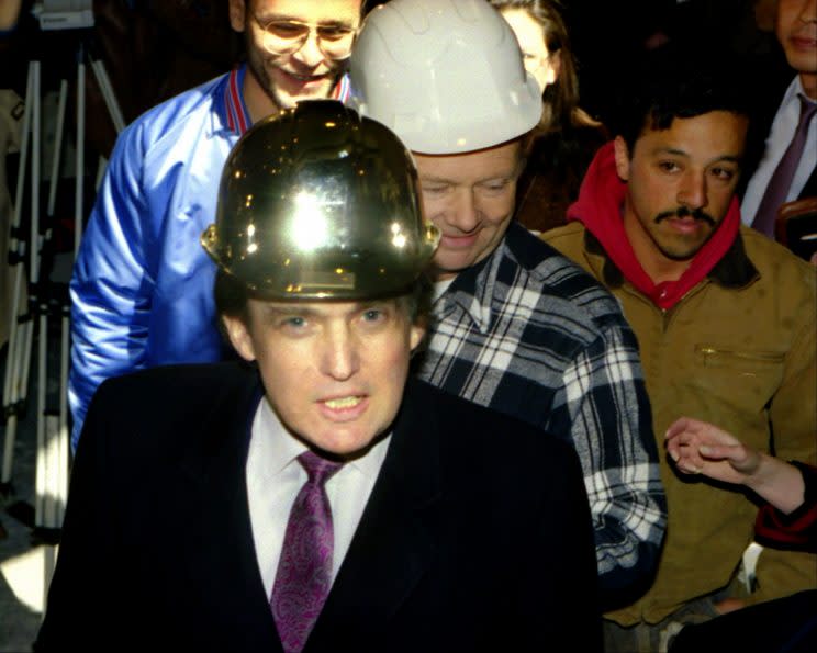 Trump sporting a gold hard hat in 1990. (Photo: Getty Images)