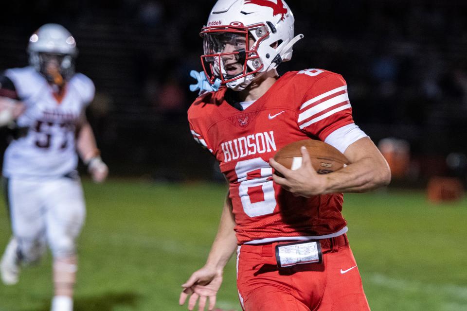 Hudson senior quarterback Jake Attaway carries the ball for some yardage, during the game against Maynard at Morgan Bowl, Oct. 5, 2024. Attaway accounted for eight touchdowns as the host Hawks (5-0) set a school record for most points in a game