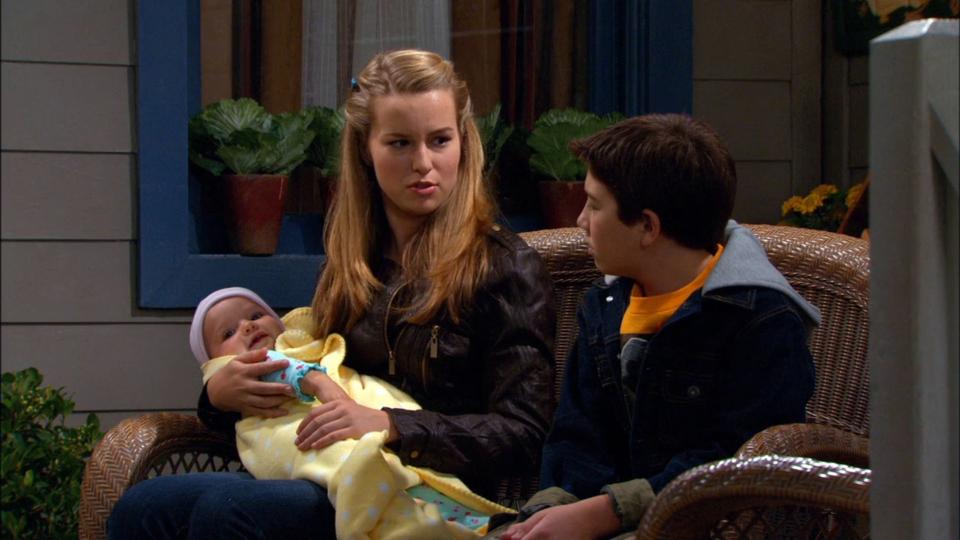 Bridgit Mendler as Teddy in the first episode of "Good Luck Charlie" with Bradley Steven Perry as Gabe Duncan and a baby (Charlie).