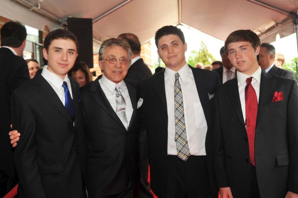 The singer (second from left) poses with his three sons, Emilio, Francesco and Brando in 2010. WireImage