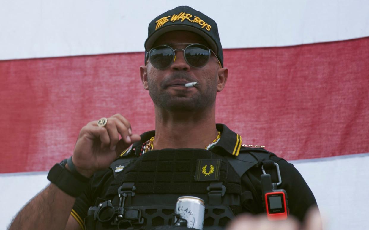 Proud Boys leader Henry "Enrique" Tarrio wears a hat that says The War Boys during a rally in Portland on January 4