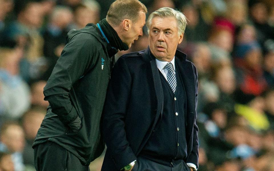 Everton's manager Carlo Ancelotti (R) reacts with Duncan Ferguson during the English Premier League soccer match between Manchester City and Everton - Rex