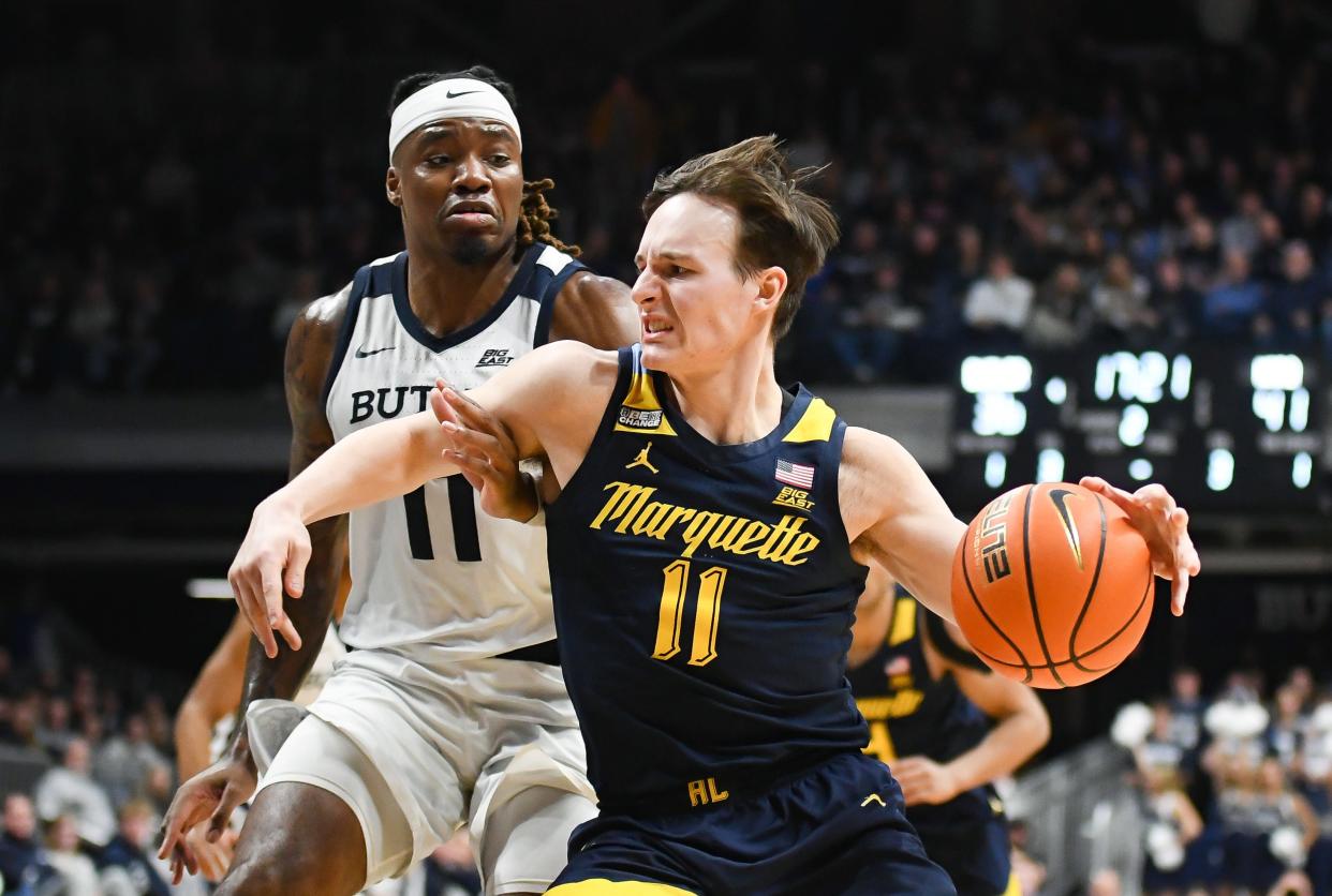 Marquette guard Tyler Kolek (11), of Cumberlad, goes to the basket against Butler during a game in February.