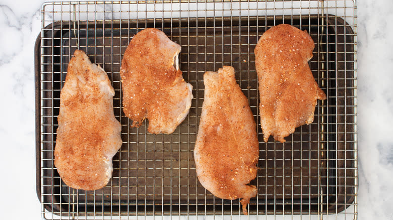 seasoned chicken on wire rack