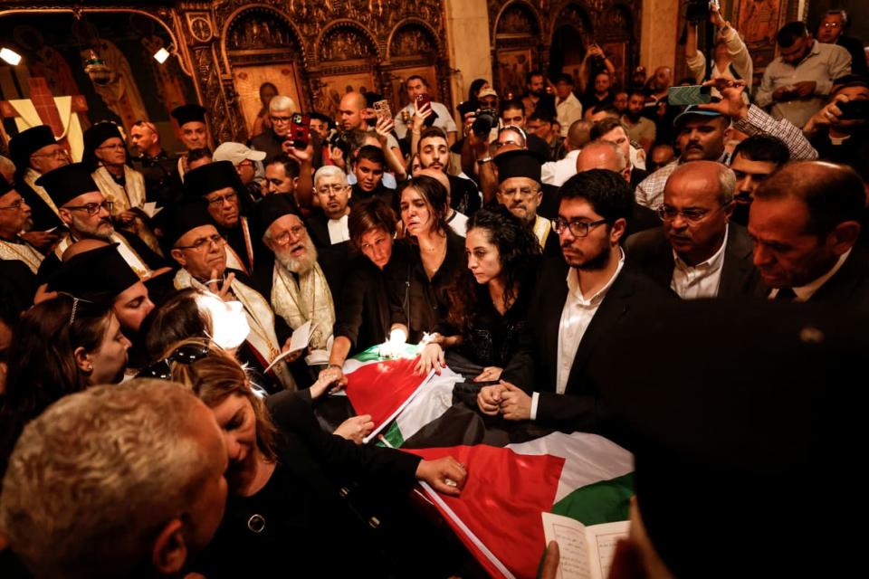 <div class="inline-image__caption"><p>Family and friends stand by the coffin of Al Jazeera reporter Shireen Abu Akleh.</p></div> <div class="inline-image__credit">AMMAR AWAD</div>